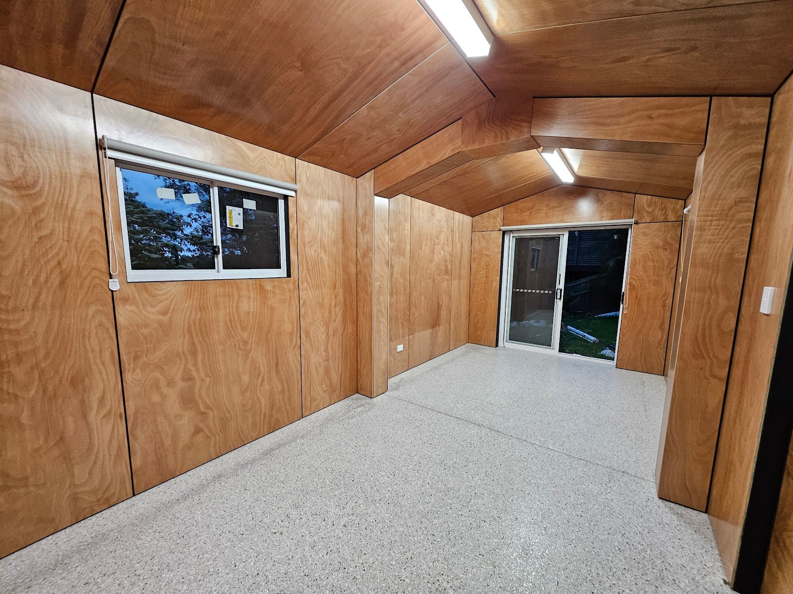 Architectural plywood wall and ceiling lining in custom studio built by Yushin Kim